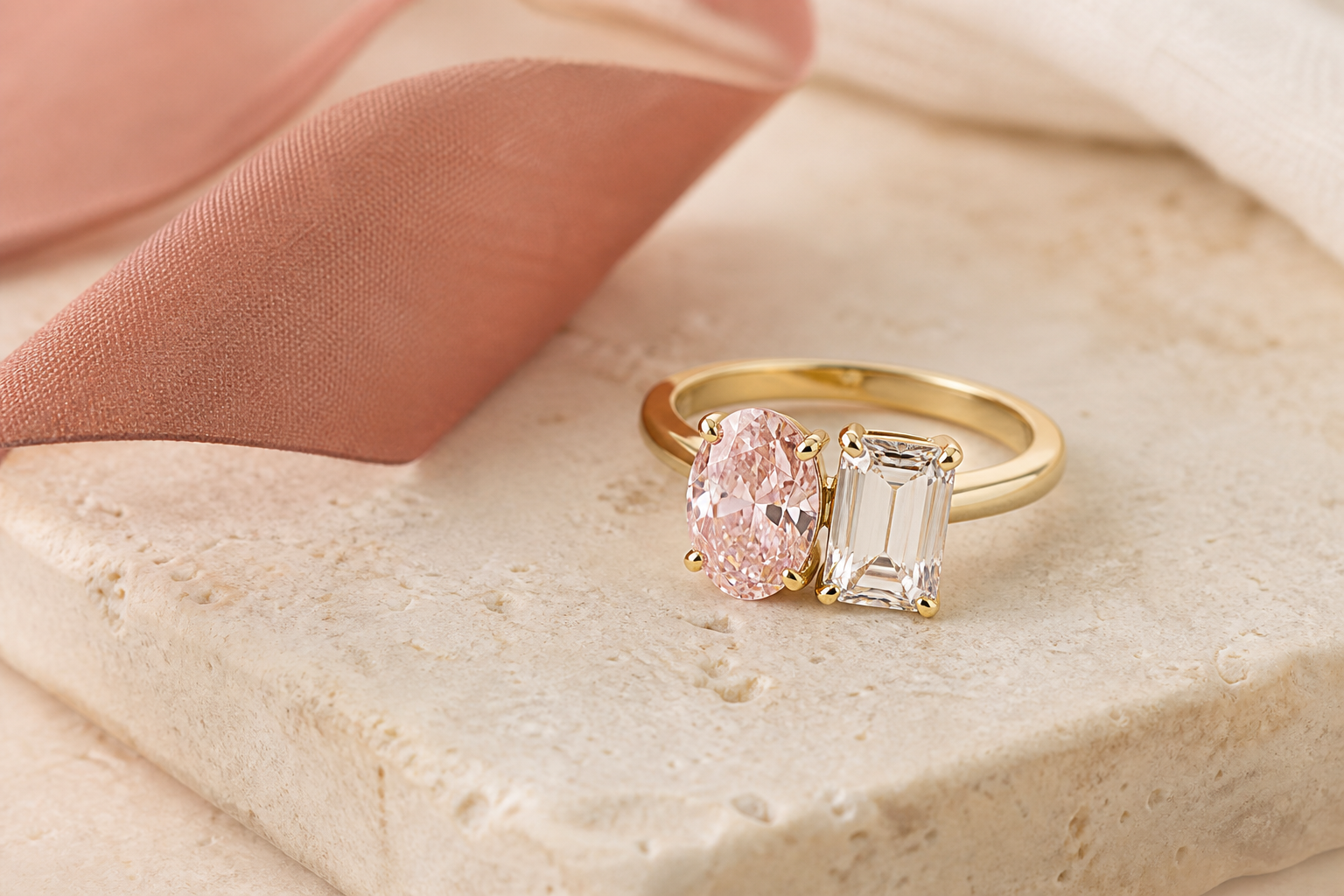 Custom Lia Fáil two-stone birthstone ring with a fancy pink oval diamond and colorless emerald-cut diamond